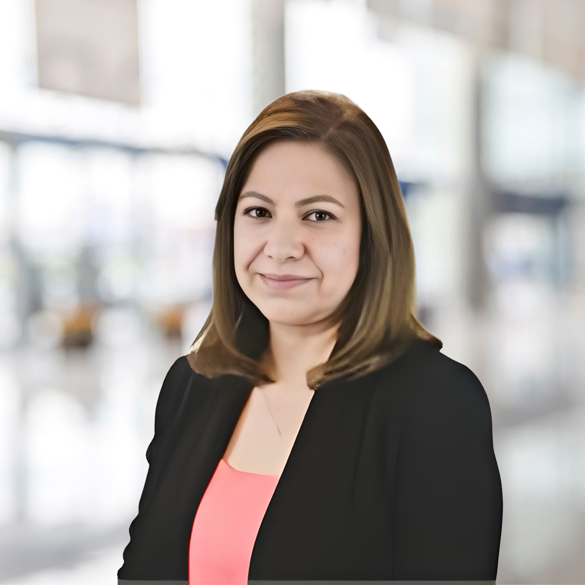 Patty, Senior Operations Manager, confidently leading a team meeting in a modern office space